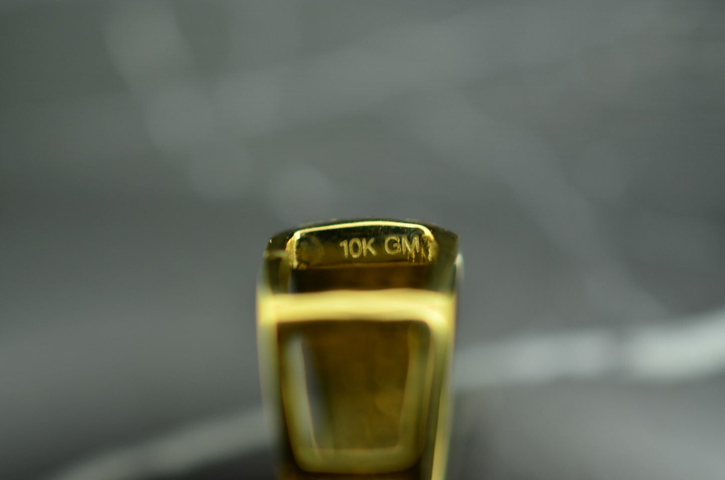 10K Yellow Gold lion head pendant covered with tiny diamonds & pink ruby eyes