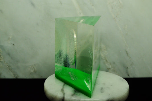 United Gem Society 1 oz .999 Silver Art Round in a Clear Triangle Paperweight