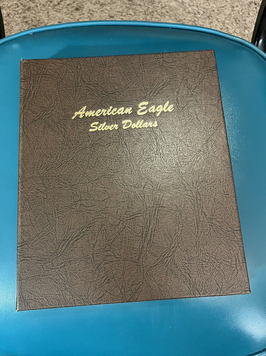Dansco album with 36 American Eagle Silver Dollars 1986-2021