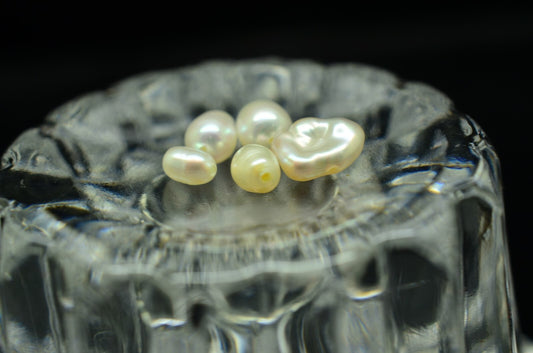 Lot of five natural white pearls -various sizes