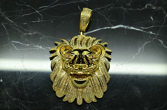 10K Yellow Gold lion head pendant covered with tiny diamonds & pink ruby eyes