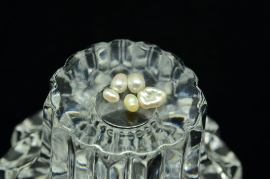Lot of five natural white pearls -various sizes