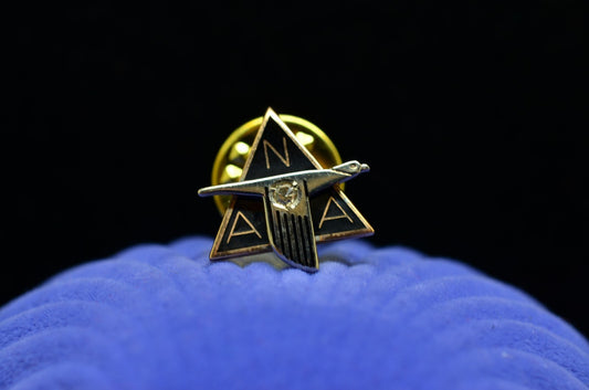10K Yellow Gold NAA North American Aviation lapel pin with diamond black enamel