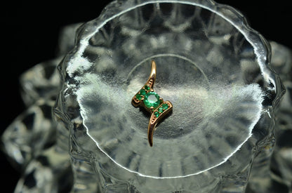 10K Rose Gold floating bypass design pendant charm with green emeralds