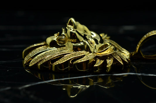 10K Yellow Gold lion head pendant covered with tiny diamonds & pink ruby eyes